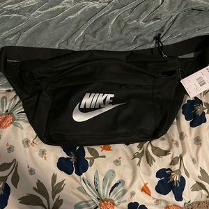 NWT- brand new Nike Tech bag. Black with silver logo